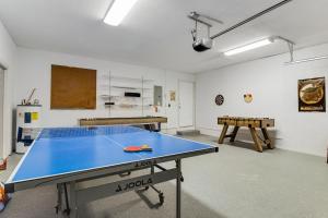 a ping pong table in the middle of a room at Vacation Station in Bradenton