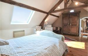 a bedroom with a large bed and a window at Lovely Home In Luneray With Wifi in Luneray