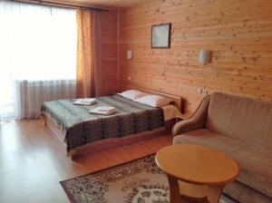 מיטה או מיטות בחדר ב-Karpatski Zori Hotel