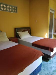 Letto o letti in una camera di Agung Pring Homestay