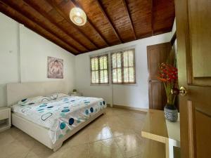 Voodi või voodid majutusasutuse finca Encanto toas