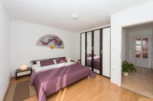Postel nebo postele na pokoji v ubytování Apartment Yasmin
