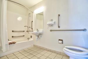 a bathroom with a toilet and a sink at Motel 6-Nogales, AZ - Mariposa Road in Nogales +44 photos