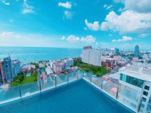 a view of the city from the balcony of a building at THE BASE Seaview holiday inn in Pattaya