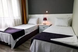 Canada Hotel & Bungalows客房内的一张或多张床位