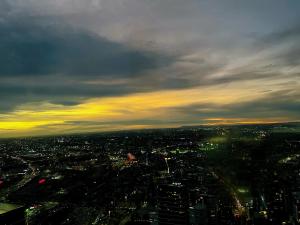 a view of a city at night with a cloudy sky at WSP luxury 2b2b apartment in CBD with free parking in Melbourne