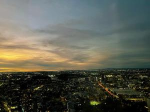 an aerial view of a city at sunset at WSP luxury 2b2b apartment in CBD with free parking in Melbourne