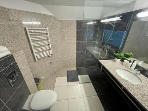 Koupelna v ubytování Apartamenty Residence Borkowo + 24 fotografií