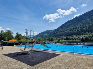 a slide in front of a swimming pool at Allgäuer Ausblick in Missen-Wilhams