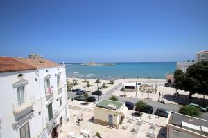 a view of a city with the ocean in the background at Appartamenti Luce Vieste in Vieste
