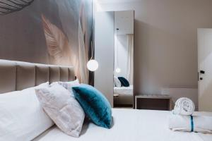 Postel nebo postele na pokoji v ubytování Ammare rooms