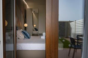 Postel nebo postele na pokoji v ubytování Ammare rooms