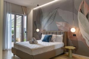 Postel nebo postele na pokoji v ubytování Ammare rooms