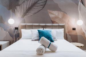 Postel nebo postele na pokoji v ubytování Ammare rooms