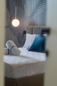 Postel nebo postele na pokoji v ubytování Ammare rooms