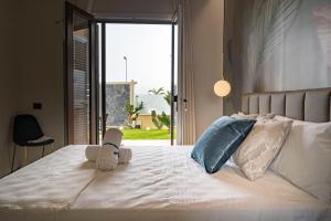 Postel nebo postele na pokoji v ubytování Ammare rooms