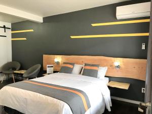 Postelja oz. postelje v sobi nastanitve Duncan Motel