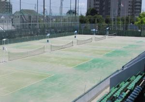 a couple of tennis courts on a tennis court at Ichinomiya City Hotel in Ichinomiya