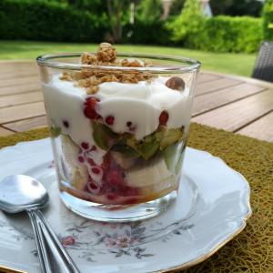 a dessert in a glass on a plate on a table at Les Trois Provinces in Couffy +31 photos