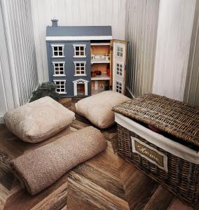 a room with two mattresses and a toy house at Cosy center Apartment in Klaipėda