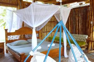 Postel nebo postele na pokoji v ubytování Fincasa del Mar-La Casa del Arbol