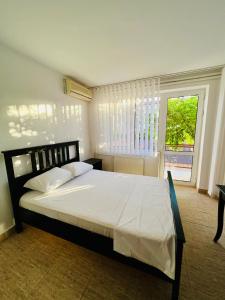 A bed or beds in a room at Hostel Bistrița