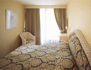 Postel nebo postele na pokoji v ubytování Hotel Marina Uno