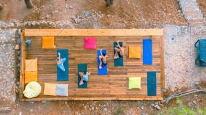 an overhead view of people in a room with colorful towels at Tree Houses Hotel in Fethiye