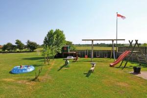 a park with a playground with a slide and swings at "Ferienhof Alte Mühle" W 2 in Bannesdorf