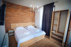 Postel nebo postele na pokoji v ubytování Hotel mia Telavi