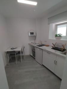 A kitchen or kitchenette at La Casita de Mari