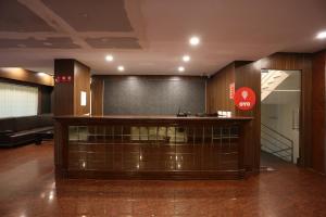 a lobby with a reception desk in a building at HOTEL RAILVIEW Bhubaneswar in Bhubaneshwar