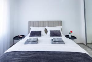 Säng eller sängar i ett rum på Apartmani Gala Foča