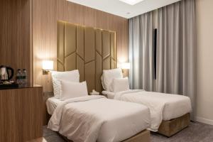 Vuode tai vuoteita majoituspaikassa Karim Hotel Riyadh