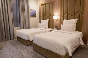 Tempat tidur dalam kamar di Karim Hotel Riyadh