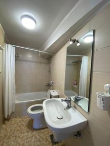 a bathroom with a sink and a toilet and a tub at (AB By The River) Apartment 801 With Great View in Cairo