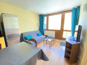 Posteľ alebo postele v izbe v ubytovaní BLocation - La Mongie - Apt 2 ch - 8 pers - Place parking couvert - Ménage en suppl