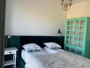 Postel nebo postele na pokoji v ubytování Botanica
