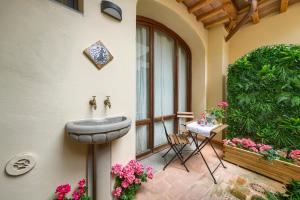 a bathroom with a sink on the side of a building at Il Giardino Fiorentino - Luxury Apartment & Spa in Florence