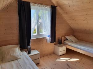 Postel nebo postele na pokoji v ubytování A&M Apartamenty + 37 fotografií