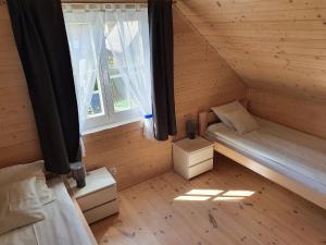 Postel nebo postele na pokoji v ubytování A&M Apartamenty