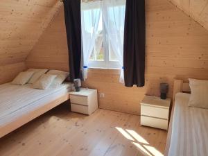 Postel nebo postele na pokoji v ubytování A&M Apartamenty
