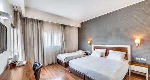 Voodi või voodid majutusasutuse Emily's Hotel toas