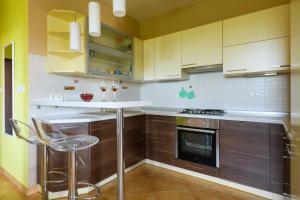 Kuchyň nebo kuchyňský kout v ubytování Apartment Sugar