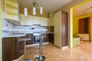 Kuchyň nebo kuchyňský kout v ubytování Apartment Sugar