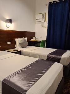 Postel nebo postele na pokoji v ubytování My Stay Hotel - Near SM Mall -1 min walk