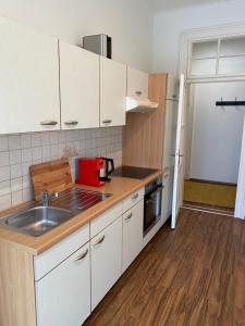 a kitchen with a sink and a counter top at Schlossberg Blick Apartment -Top 7 self check-in in Graz