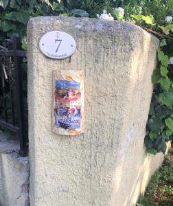 a clock on the side of a stone wall at Taverna Costa dei Trabocchi in Fossacesia