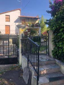 a black iron gate with stairs in front of a house at Taverna Costa dei Trabocchi in Fossacesia