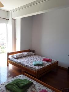 Postel nebo postele na pokoji v ubytování Alex Central City Accommodation